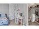 Cozy bedroom features a makeup vanity with drawers and mirror and a walk-in closet at 8355 Velda Trl, Sarasota, FL 34241