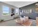 Cheerful bedroom with ample windows, a dark accent wall, and playful decor at 8355 Velda Trl, Sarasota, FL 34241
