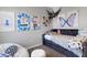 Teen bedroom with decorative art, light walls, and ample natural light at 8355 Velda Trl, Sarasota, FL 34241