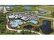 Aerial view shows a resort-style community pool with ample seating and lush landscaping at 8355 Velda Trl, Sarasota, FL 34241