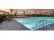 Outdoor pool with a beautiful sunset sky and palm trees offering a serene outdoor space at 8355 Velda Trl, Sarasota, FL 34241