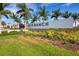 Community sign for Skye Ranch Sarasota with colorful landscaping and a grassy field at 8355 Velda Trl, Sarasota, FL 34241