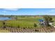 A shaded picnic area is fenced and features a lake view at 8355 Velda Trl, Sarasota, FL 34241