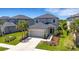 Well maintained two-story home featuring a two-car garage and manicured lawn at 8355 Velda Trl, Sarasota, FL 34241
