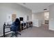 Upstairs hallway has a work space and leads to a bathroom, providing extra space for multiple activities at 8355 Velda Trl, Sarasota, FL 34241