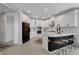 Modern kitchen with an island, stainless steel appliances, and black and white cabinets at 8355 Velda Trl, Sarasota, FL 34241