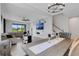Open living room featuring a large window, modern furnishings, and tile floors at 8355 Velda Trl, Sarasota, FL 34241
