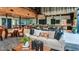 Common area with high ceilings, modern furniture, and kitchenette at 8355 Velda Trl, Sarasota, FL 34241