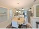 Bright dining area with natural light and open view to the kitchen and living spaces at 8404 Imperial Cir # 8404, Palmetto, FL 34221