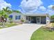 Charming single-story home featuring a wide driveway, a screened-in porch, and well-maintained landscaping at 8404 Imperial Cir # 8404, Palmetto, FL 34221