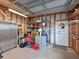 Well-organized garage featuring ample storage shelves, a metal cabinet, and a clean epoxy floor at 8404 Imperial Cir # 8404, Palmetto, FL 34221