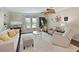 Bright living room featuring a ceiling fan, plush carpeting, and ample natural light at 8404 Imperial Cir # 8404, Palmetto, FL 34221