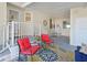 Inviting screened-in lanai featuring an outdoor ceiling fan, comfortable seating, and stylish decor at 8404 Imperial Cir # 8404, Palmetto, FL 34221
