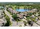 Stunning aerial view of a property with a lake and golf course nearby, surrounded by lush landscaping and well-maintained homes at 8630 51St E Ter, Bradenton, FL 34211