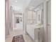 Bright bathroom with marble countertops, large mirror, and access to the soaking tub at 8630 51St E Ter, Bradenton, FL 34211