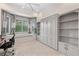 Neutral colored room with built-in shelving, and bay window with seat at 8630 51St E Ter, Bradenton, FL 34211
