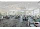 Spacious dining room with tables, chairs, elegant lighting, and views of the community at 8630 51St E Ter, Bradenton, FL 34211
