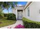 Inviting front entrance with double doors and a well-manicured garden at 8630 51St E Ter, Bradenton, FL 34211