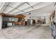 Well-lit garage with abundant storage space, perfect for organizing tools and equipment at 8630 51St E Ter, Bradenton, FL 34211