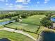 Scenic aerial view of the golf course, showcasing lush fairways and water features at 8630 51St E Ter, Bradenton, FL 34211