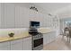 Contemporary kitchen equipped with modern appliances and lots of white cabinet storage space at 8630 51St E Ter, Bradenton, FL 34211