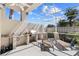 Screened patio with outdoor kitchen, lounge chairs, and tropical landscaping at 8630 51St E Ter, Bradenton, FL 34211