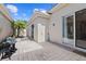 Private patio with brick pavers, showcasing an outdoor seating area and well-maintained exterior at 8630 51St E Ter, Bradenton, FL 34211