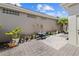 Inviting outdoor patio featuring brick pavers, potted plants, and a cozy seating arrangement at 8630 51St E Ter, Bradenton, FL 34211