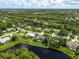 Aerial view with property line of community and home close to lake at 8687 Woodbriar Dr, Sarasota, FL 34238