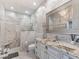 Luxurious bathroom featuring a large marble shower, decorative lighting and accents at 8687 Woodbriar Dr, Sarasota, FL 34238