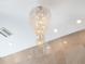Crystal chandelier with cascading strands, adding a touch of elegance to the home's interior at 8687 Woodbriar Dr, Sarasota, FL 34238