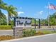 Elegant 'Deer Creek on Palmer Ranch' community entrance sign with landscaping at 8687 Woodbriar Dr, Sarasota, FL 34238