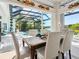 Dining room overlooking pool area features stylish decor and an airy, open ambiance at 8687 Woodbriar Dr, Sarasota, FL 34238