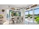 Elegant dining room with contemporary decor, natural light, and access to the lanai at 8687 Woodbriar Dr, Sarasota, FL 34238