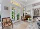 Open foyer featuring tile flooring, large glass front doors and plenty of natural light at 8687 Woodbriar Dr, Sarasota, FL 34238