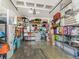 Garage with ample storage, organized with shelving units at 8687 Woodbriar Dr, Sarasota, FL 34238