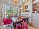 Home office featuring custom built-ins, a large desk, and abundant natural light at 8687 Woodbriar Dr, Sarasota, FL 34238