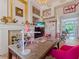 Bright home office featuring custom built-ins, a large desk, and unique decor at 8687 Woodbriar Dr, Sarasota, FL 34238