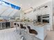Stylish kitchen with skylight and breakfast bar, showcasing modern appliances and an open layout at 8687 Woodbriar Dr, Sarasota, FL 34238