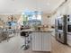 Elegant kitchen with large island, modern appliances and a gorgeous skylight view at 8687 Woodbriar Dr, Sarasota, FL 34238