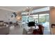 Bright, open-concept living area with water views, luxury decor, and access to the screened pool at 8687 Woodbriar Dr, Sarasota, FL 34238