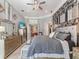 Beautiful main bedroom with a stylish accent wall, plush bedding, and ample natural light at 8687 Woodbriar Dr, Sarasota, FL 34238