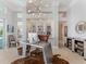 Bright home office space featuring modern lighting, custom built-ins, and an industrial-style metal desk at 8687 Woodbriar Dr, Sarasota, FL 34238