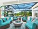 Relaxing patio area with plush seating and an outdoor living space perfect for entertaining at 8687 Woodbriar Dr, Sarasota, FL 34238