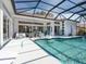 A view of the pool area highlighting the pool, patio, lounge furniture, and outdoor space at 8687 Woodbriar Dr, Sarasota, FL 34238
