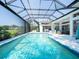 Enjoy swimming in this screened-in pool near the patio and outdoor seating area at 8687 Woodbriar Dr, Sarasota, FL 34238