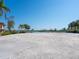 Waterfront vacant lot with lush tropical landscaping and serene water views, ready for your dream home at 894 Freeling Dr, Sarasota, FL 34242