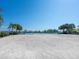 Waterfront vacant lot ready for development with seawall and mature trees and shrubbery surrounding the property at 894 Freeling Dr, Sarasota, FL 34242