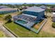 Aerial view of the back of the home, screened in pool and lake at 9307 Raes Creek Pl, Palmetto, FL 34221