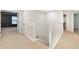 Bright upstairs hallway with white banister and carpeted floors at 9307 Raes Creek Pl, Palmetto, FL 34221